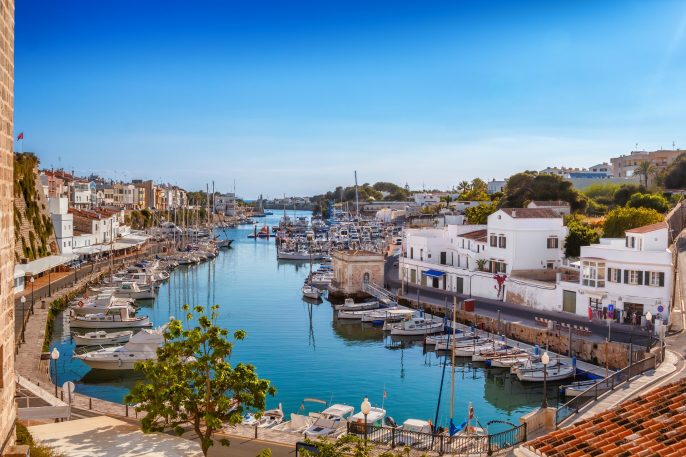 Menorca View on old town Ciutadella sea port on sunny day shutterstock_554710495